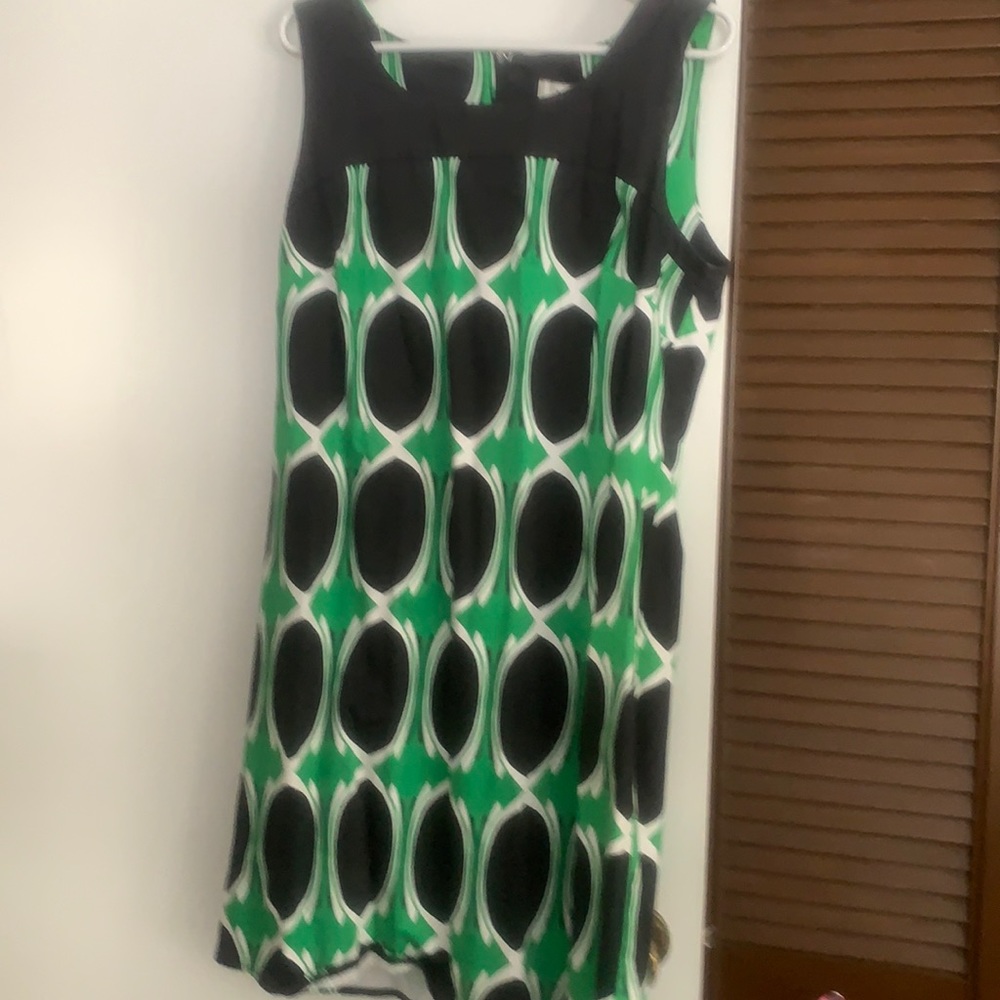 Slight stretch mini dress.  Sleeveless style with darts in breast area.